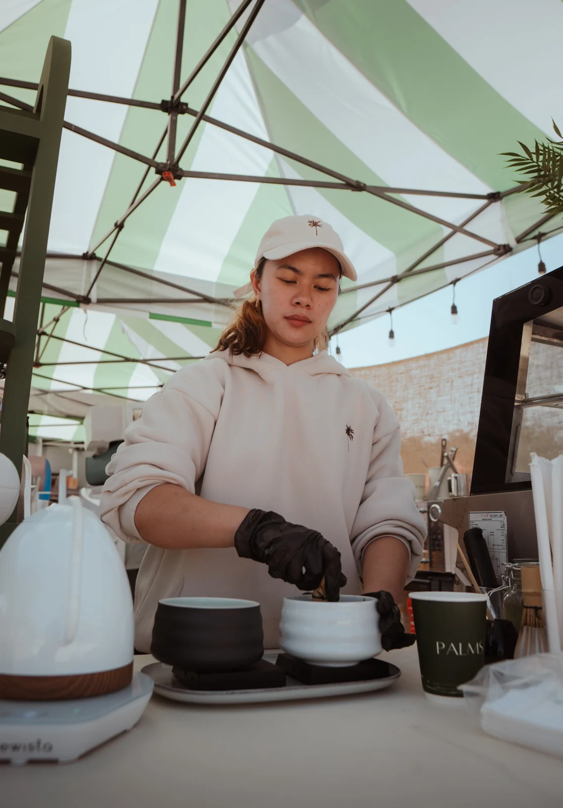 Barista preparing coffee at PALMS