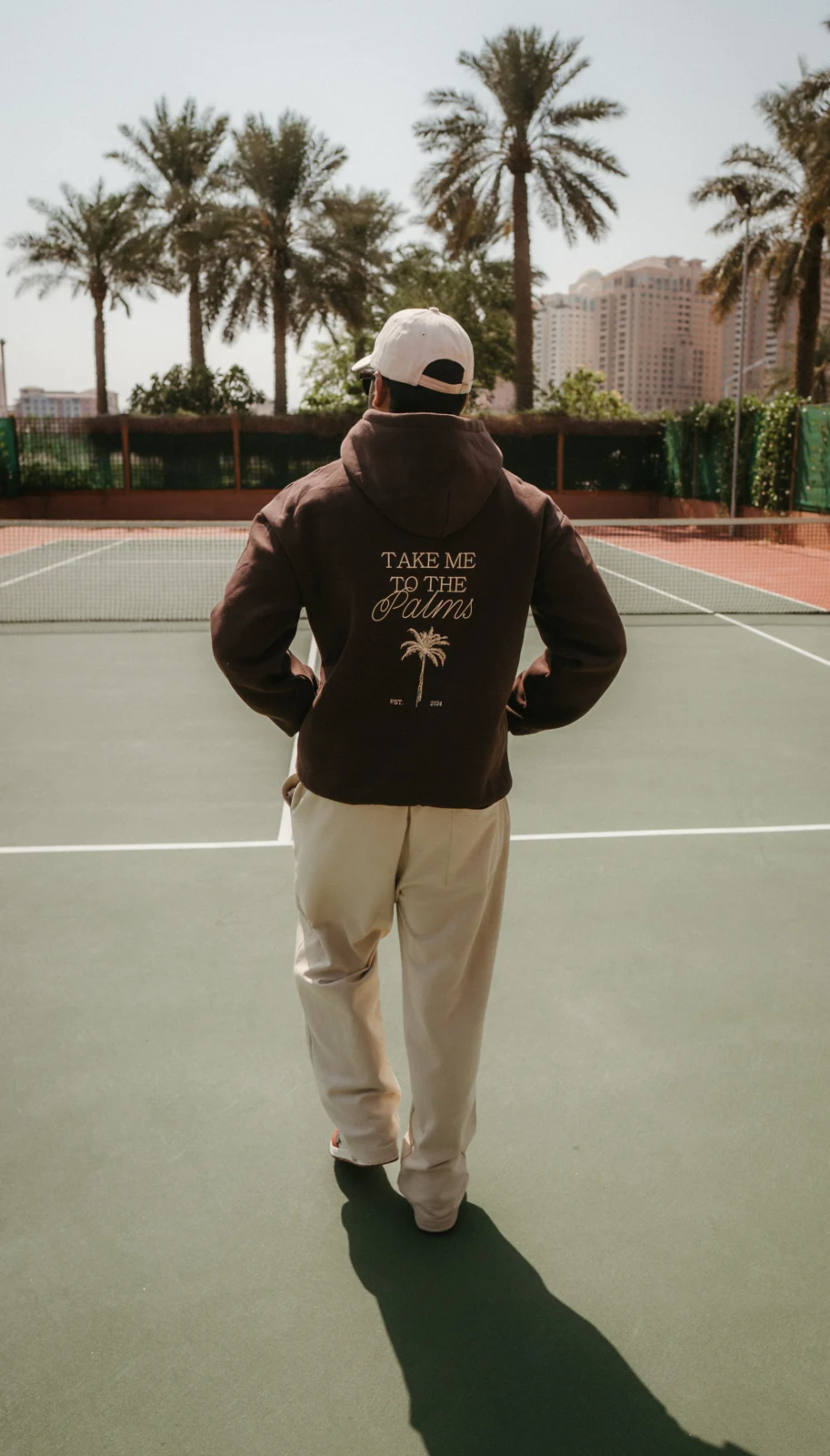 Model in casual clothing on an outdoor court