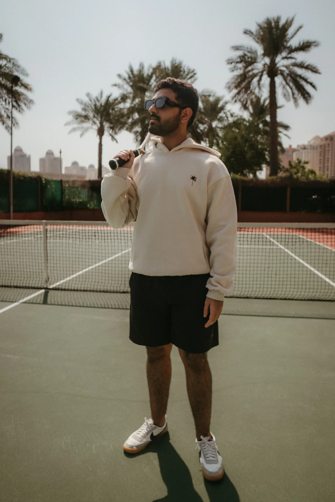 White PALM’S outfit on a tennis court