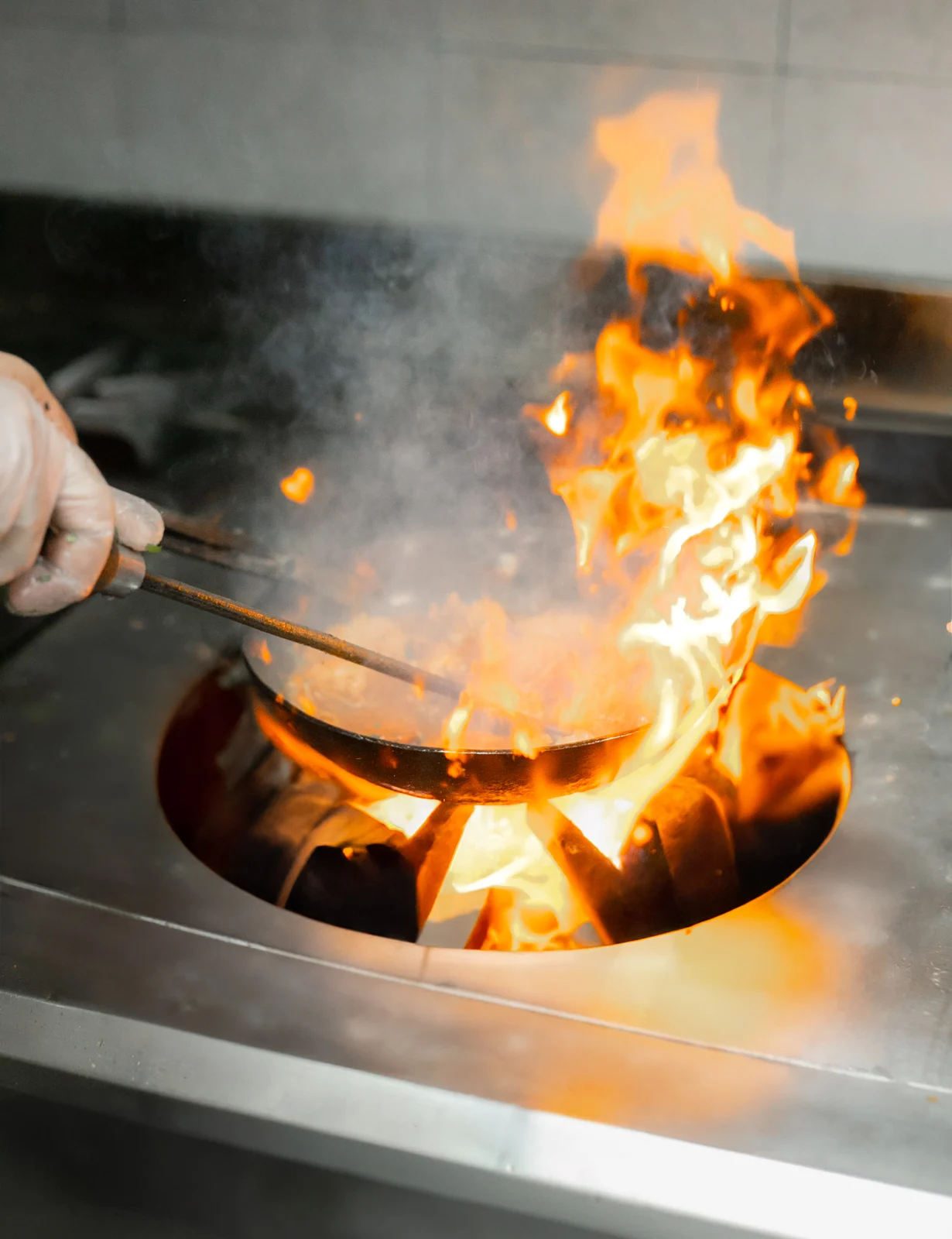 Chef cooking over a flame at Kebabbq Tonight