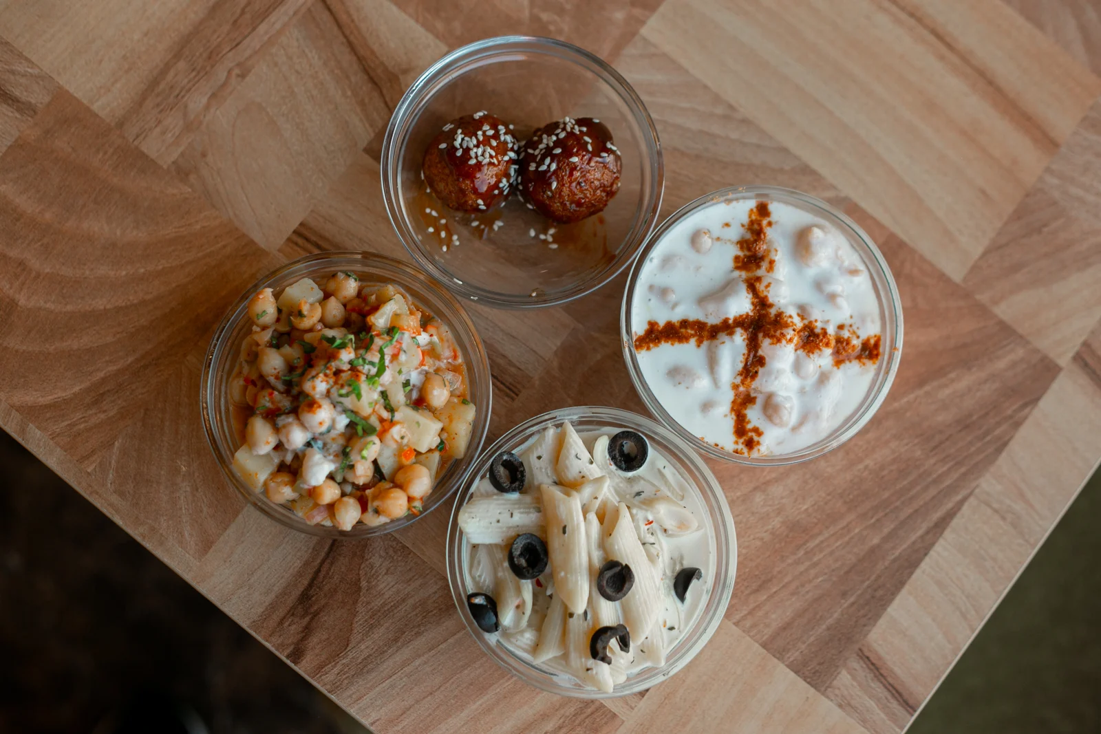 Restaurant dishes arranged across a wooden table
